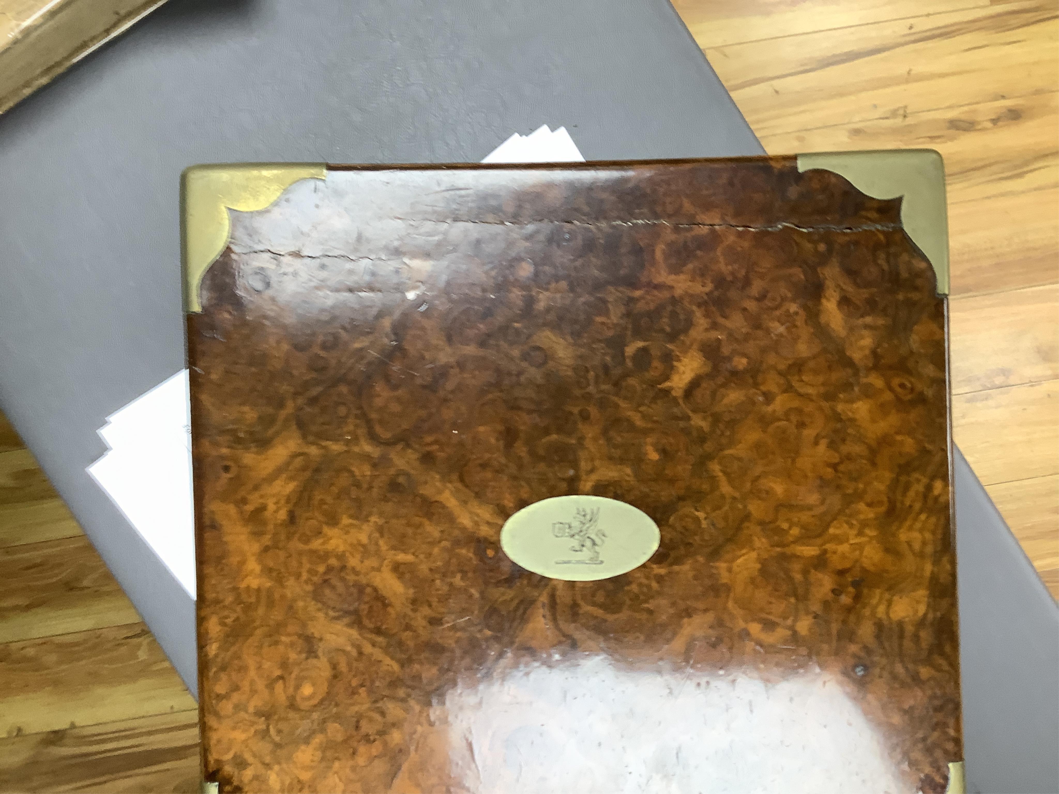 A Victorian burr walnut and brass bound four bottle decanter box, the four faceted square decanters with Victorian silver spirit labels, Bramah lock with key, 26cm high